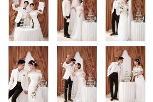 Cặp đôi trong bộ ảnh cưới studio sang trọng với váy cưới trắng tinh khôi và vest trắng thanh lịch, phong cách Hàn Quốc hiện đại, tông màu trung tính nhẹ nhàng.
